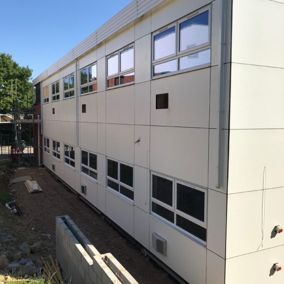 Rockpanel crew fixed to timber battens on modular building img